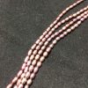 Perla ovalada color burdeo, 2mm