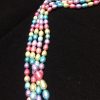 Perla ovalada multicolor en tonos claros, 5mm