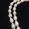 Perla shell gota orizontal color blanca