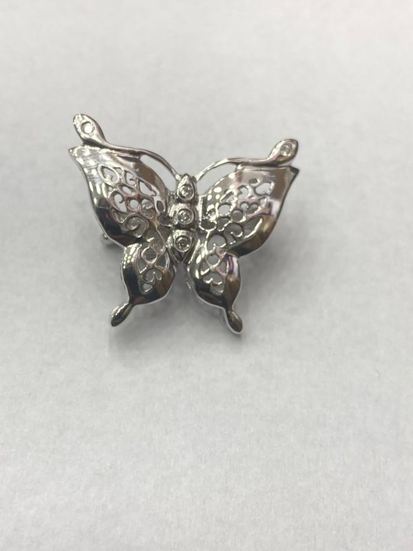 BROCHE MARIPOSA CON IMÁN Y CIRCONES.